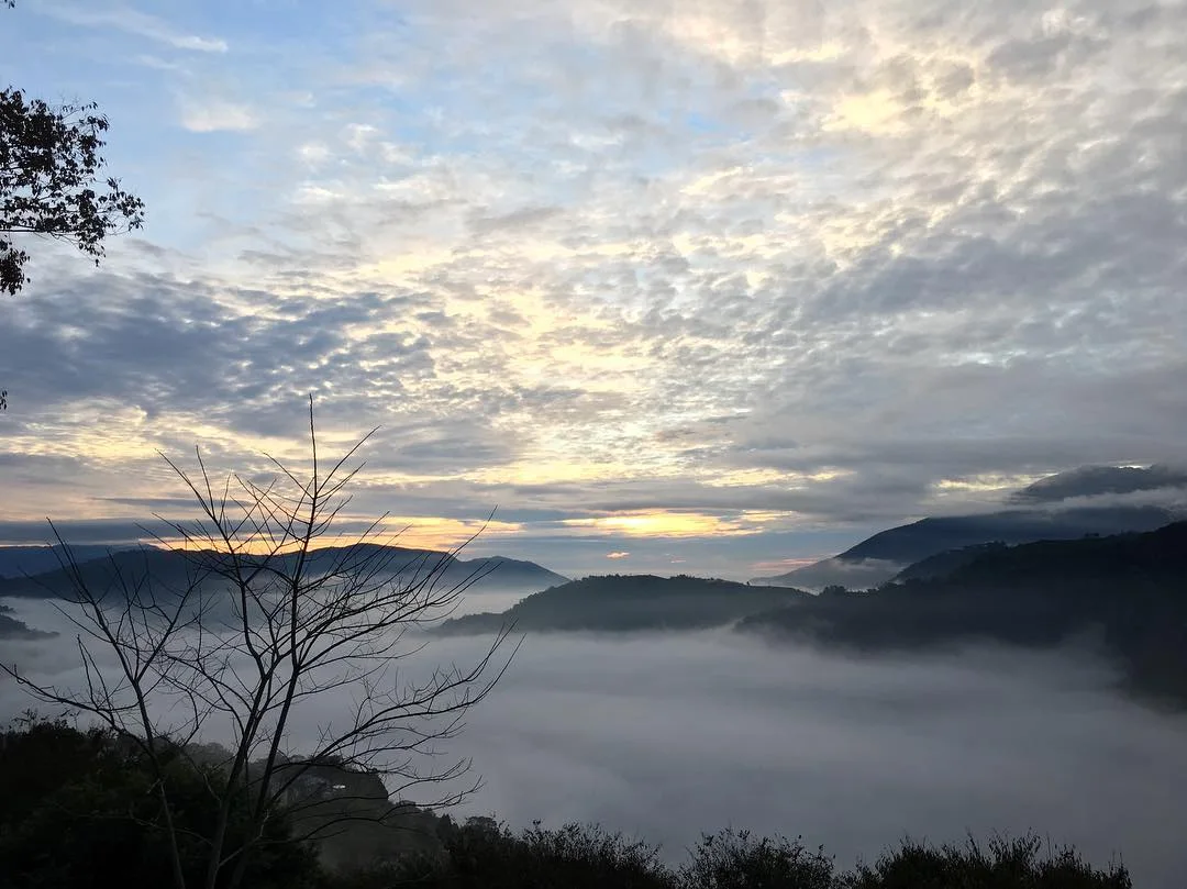 Layers of mountains above a sea of clouds